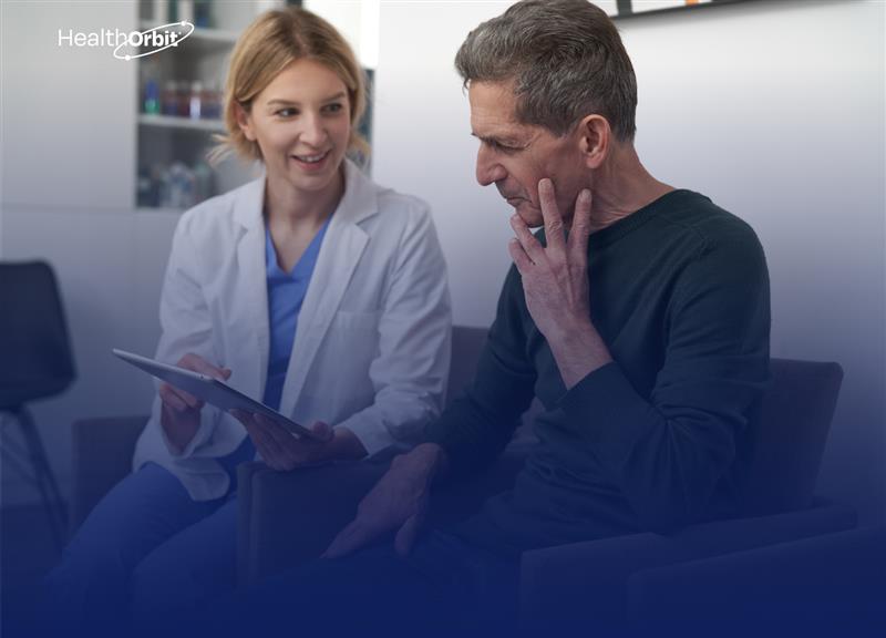 A smiling doctor is showing a report to a patient. The report is about mental health therapy.