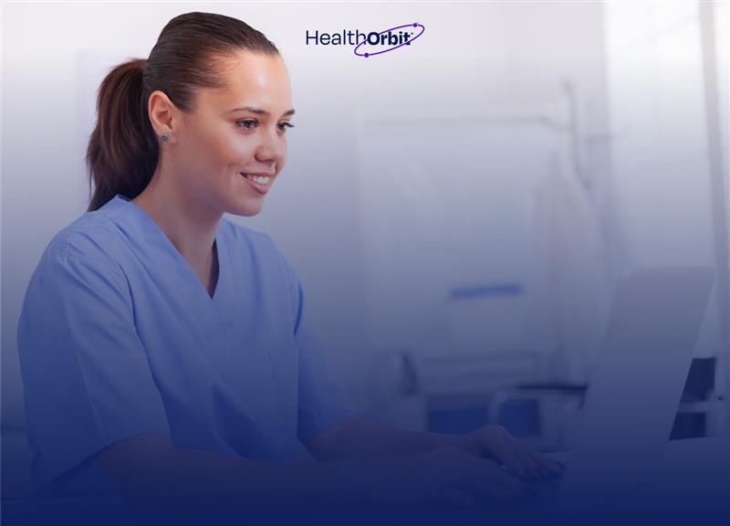 Physical therapist documenting SOAP notes on a laptop in a clinic for patient progress tracking.