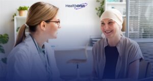 Oncologist consults patient with support from ambient AI scribe for complex cancer care.