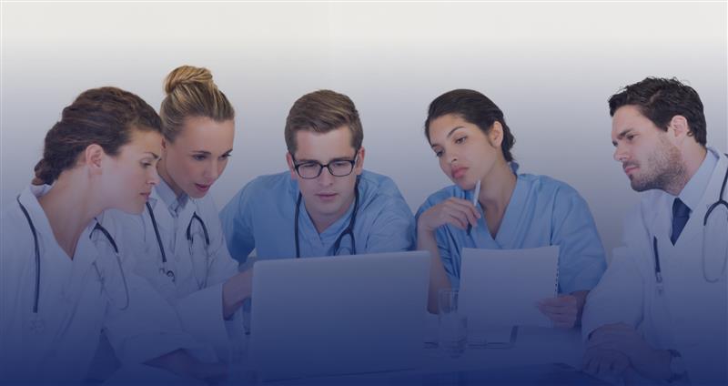 Multidisciplinary team collaborating with MDT assistant for coordinated patient care planning